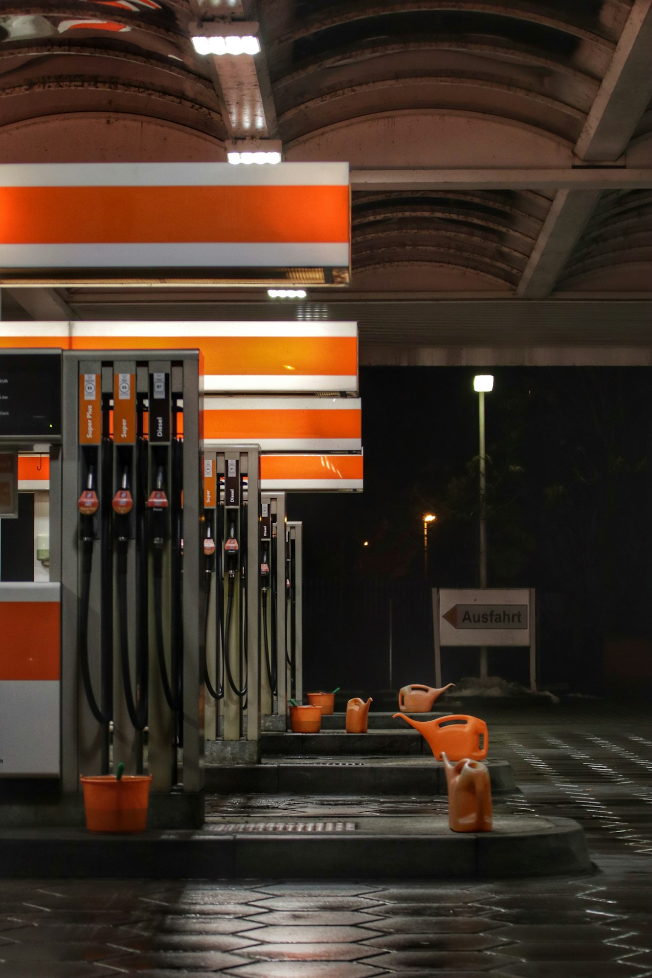 Vertical shot of a gas station in the night